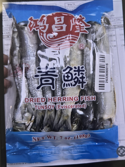 Front label of Dried Herring Fish packaged in clear, plastic 7 oz bag with blue trim