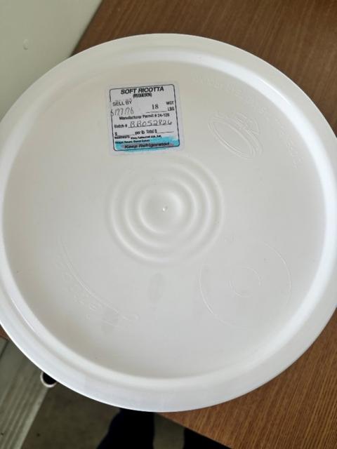 Photograph of label on white bucket of Soft Ricotta Cheese, 2 gallon